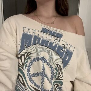 American eagle Blue and cream bob marley off the shoulder sweatshirt 
Size S-M